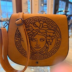 Chic Tan Crossbody Bag with Artistic Emblem